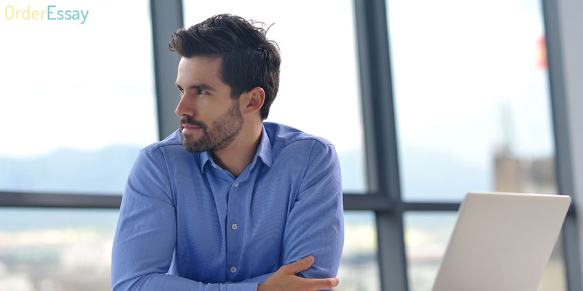 Handsome Man Sitting at Table