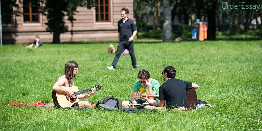 Students Playing Guitar in the Uni Yard